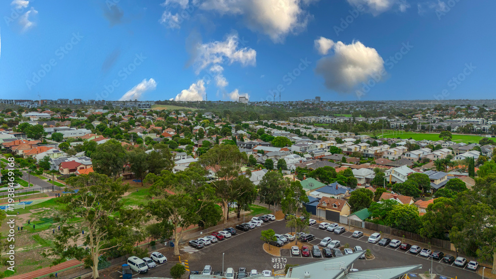 Obraz premium Panoramic Aerial Drone view of Inner Suburbs of Melbourne housing, roof tops, the streets and the parks, the roads and trees of Ascot Vale Moonee Ponds Brunswick Essendon and Maribyrnong in VIC Victor