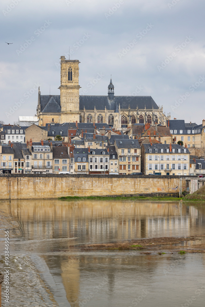 Fototapeta premium Nevers cathedral and city reflecting in river Loire