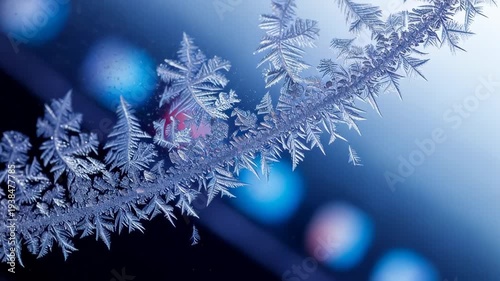 Frosty window with snowflakes and lights.