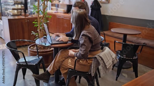 Wallpaper Mural Woman working on laptop and drinking coffee at large window cafe table with sunlight. Coffee break, laptop, sunlight, cafe table, working woman. Torontodigital.ca