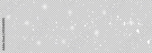 Freeze motion of natural snow falling on transparent background. Falling down real snowflakes