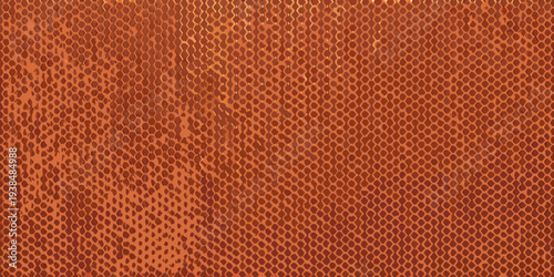 Close up of a textured orange brown surface resembling reptile skin