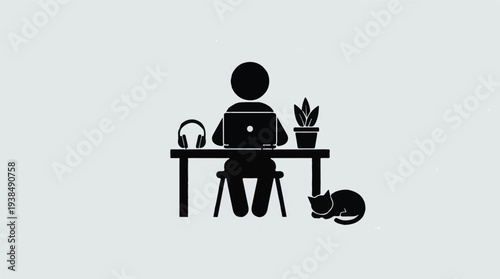 Person working on laptop in a cozy home office with headphones, plant, and cat