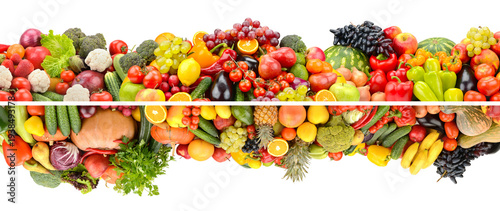 Wide composition of bright fruits, vegetables and berries isolated on white