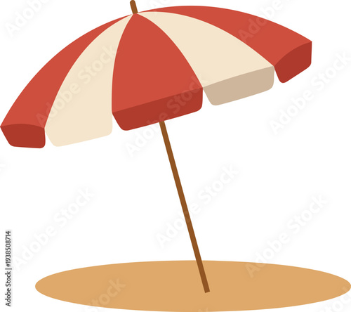 Red and white beach umbrella on sandy shore