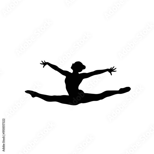 Silhouette of a female dancer performing a jump split.