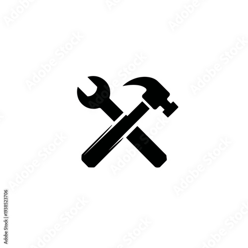 A black and white graphic of a wrench crossed with a hammer set against a white background