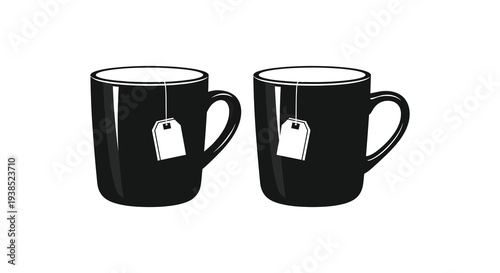 Two black mugs filled with tea each with a teabag and string are displayed high quality