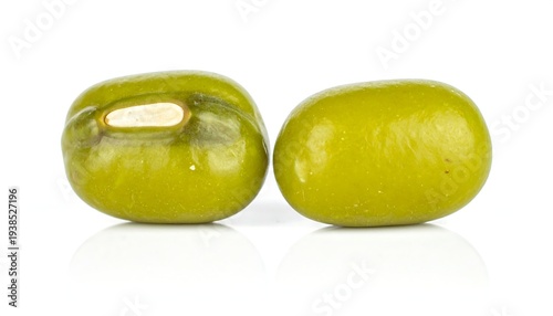 Two green mung beans side by side, close-up, on a white background with slight reflection