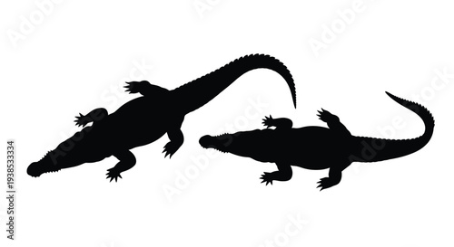 Two black silhouettes of alligators in a natural pose silhouette