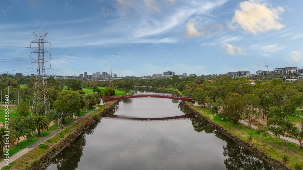 Fototapeta premium Panoramic Aerial Drone view of Inner Suburbs of Melbourne housing, roof tops, the streets and the parks, the roads and trees of Ascot Vale Moonee Ponds Brunswick Essendon and Maribyrnong in VIC Victor
