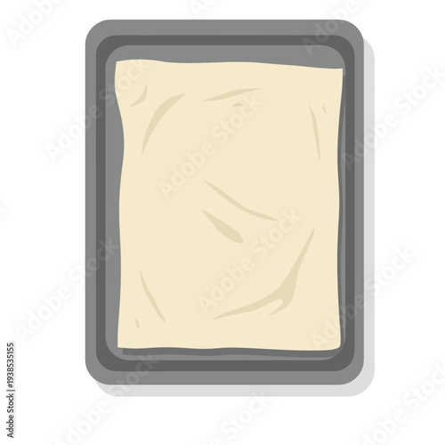 A top-down view of a baking sheet lined with parchment paper, ready for use.