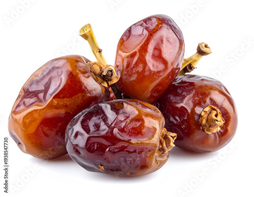A cluster of four shiny, brown, wrinkled, dried fruits