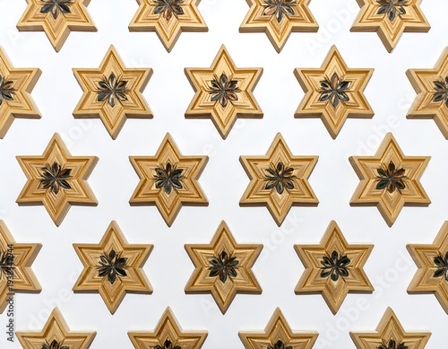 Repeating wooden star shapes with intricate floral center detail