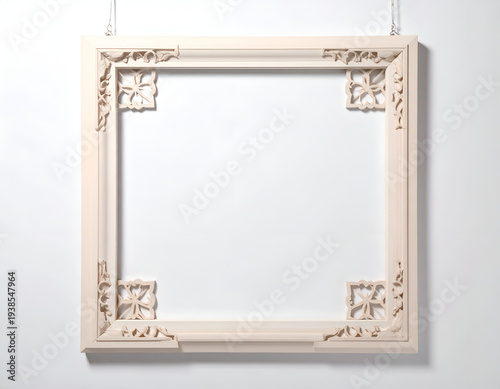 Ornate, light wood frame with corner carvings, hanging