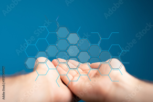 Abstract image of hands interacting with a digital network, representing technology, data and connectivity on a blue bac