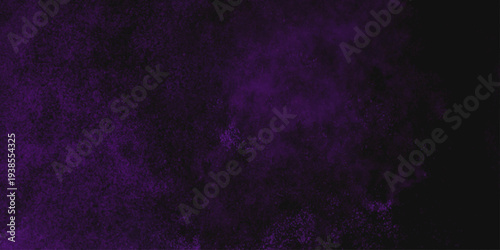 Freeze motion explosion of purple powder dust on a black background. abstract background with a textured gradient effect, suitable for wallpapers or graphic designs. Purple Smoke Cloudscape Texture.