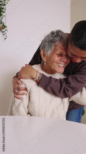 Affectionate grandchild hugging elderly grandmother with love