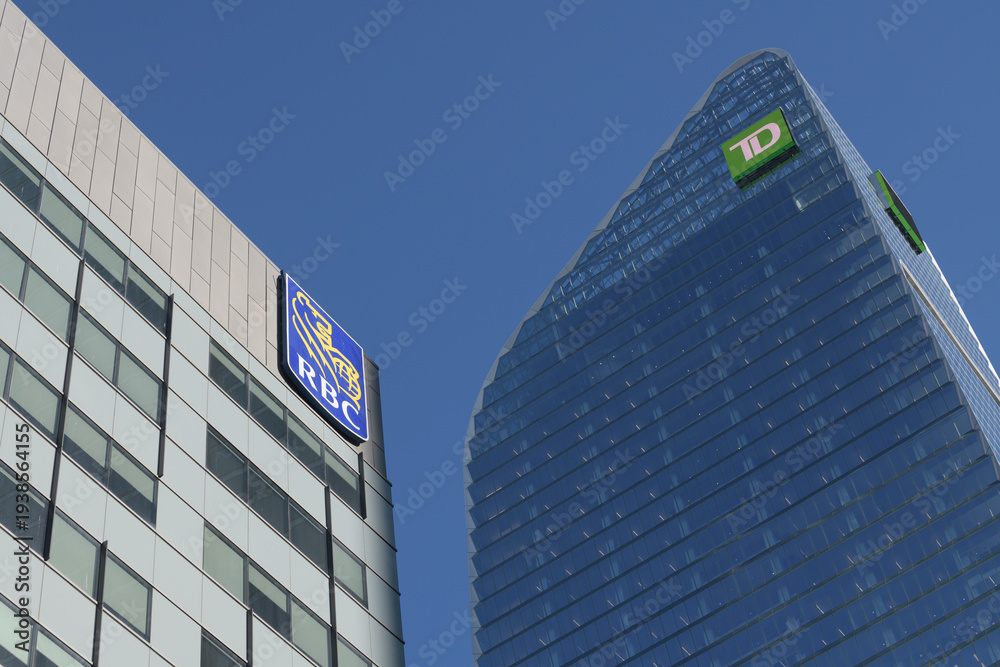 Fototapeta premium RBC sign on the exterior of a building near Wellington St W and Simcoe, including TD sign at the top of TD Terrace, Toronto