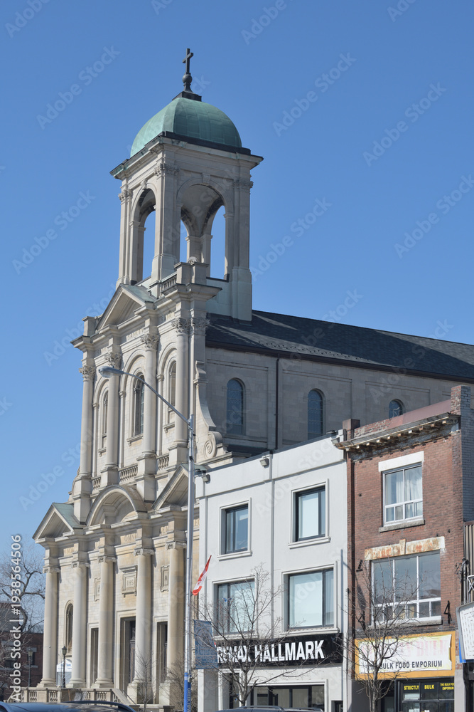 Naklejka premium exterior of Holy Name Parish and RE/MAX Hallmark Realty Ltd., Brokerage, a real estate agency, located at 630 Danforth Av, Toronto