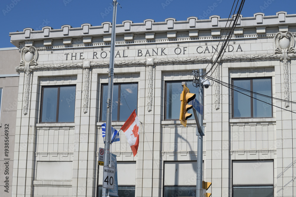 Fototapeta premium exterior facade and inscription sign of The Royal Bank of Canada, a heritage branch, designed by Bond & Smith, 1925, located at 646 Danforth Av, Toronto