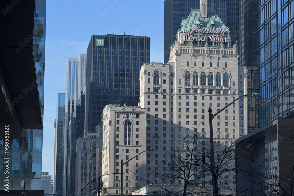 Fototapeta premium looking north on York St to Fairmont Royal York hotel and modern office towers (TD Centre) from about Lake Shore Blvd W, Toronto