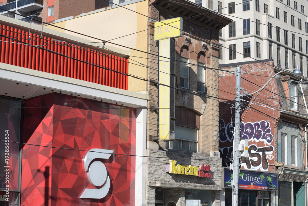 Naklejka premium looking east on Queen St W to Scotiabank branch, Korean Grill House, and Ginger Restaurant, Toronto