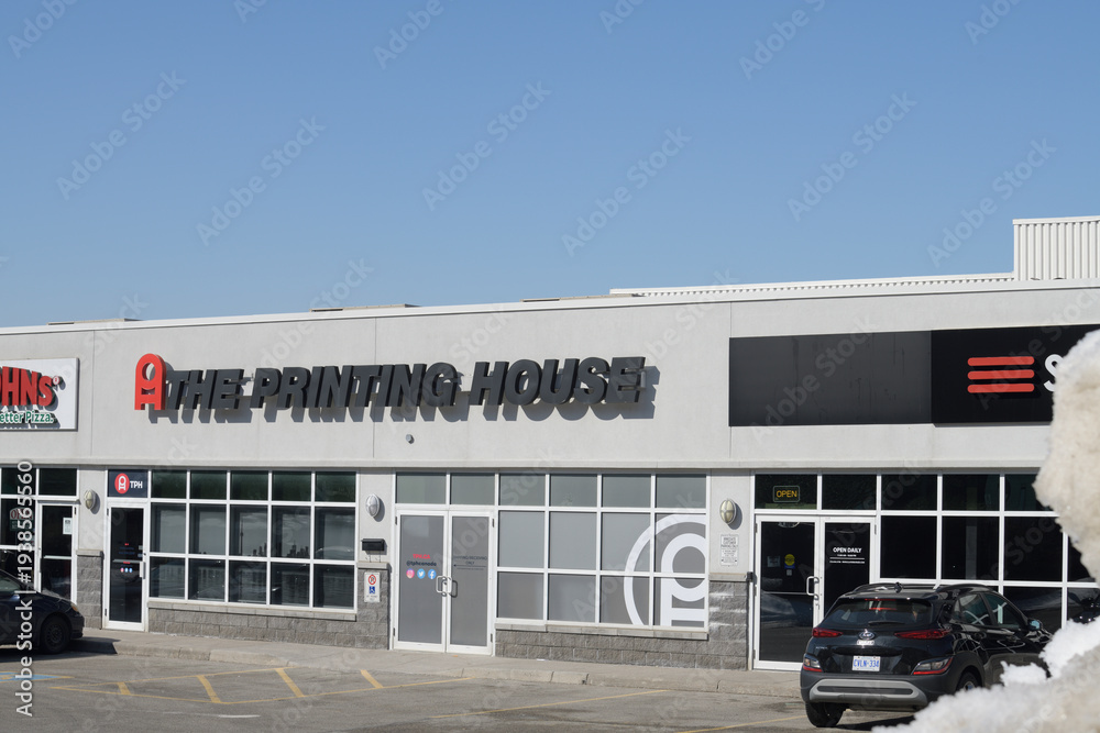 Fototapeta premium exterior building facade and sign of TPH The Printing House, a digital printing service, located here at 1400 O'Connor Dr, East York, Toronto