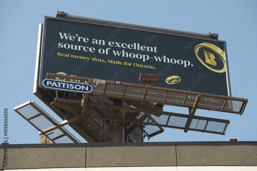 Obraz premium oblique angle view of a rooftop billboard advertising sign for Betty online gambling in Toronto