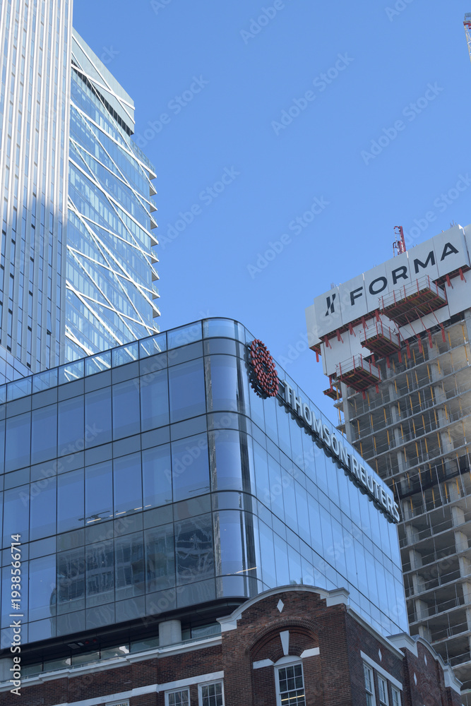 Obraz premium exterior building and sign of Thomson Reuters a mixed use complex located at 19 Duncan St (FORMA condo development), Toronto