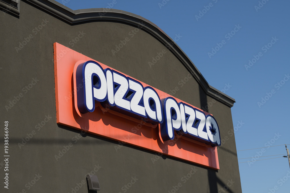 Naklejka premium exterior building facade and sign of Pizza Pizza, a pizza restaurant, located at 796 O'Connor Dr, East York, Toronto