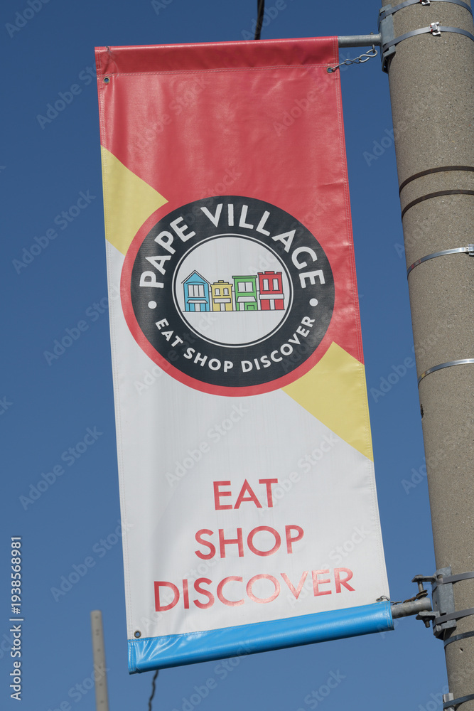 Obraz premium close-up of a Pape Village BIA pole mounted banner, East York, Toronto