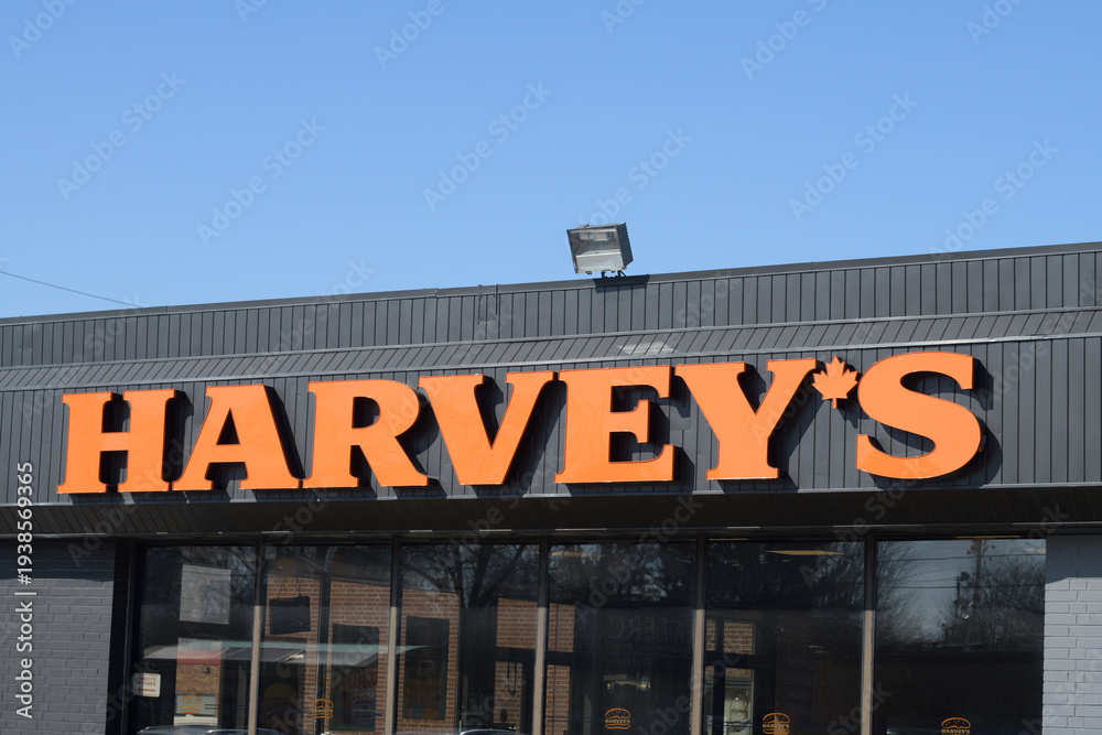 Fototapeta premium sign on the exterior of Harvey's Canada restaurant located here at 1100 O'Connor Dr, Toronto