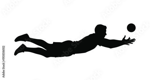 Volleyball player diving for the ball a striking black silhouette