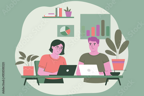 Two colleagues collaborate on laptops at a modern office workspace