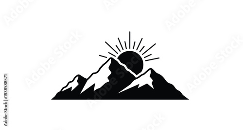 Dramatic mountain range with a rising sun stark black silhouette