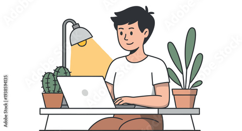 Young man works comfortably at his desk illuminated by a warm desk lamp.