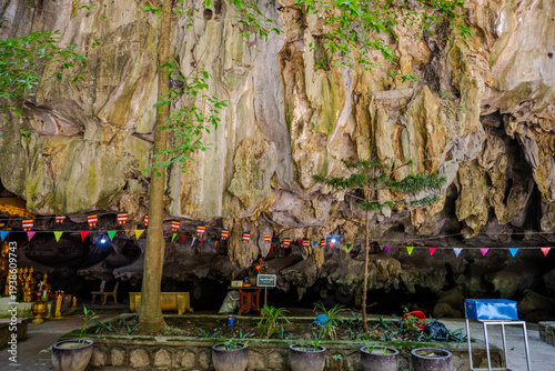 Foto Decorated cave shrine with stalactites and small trees