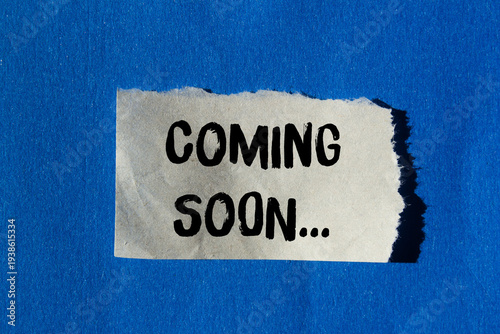 Slika na platnu Coming soon message written on ripped torn paper background