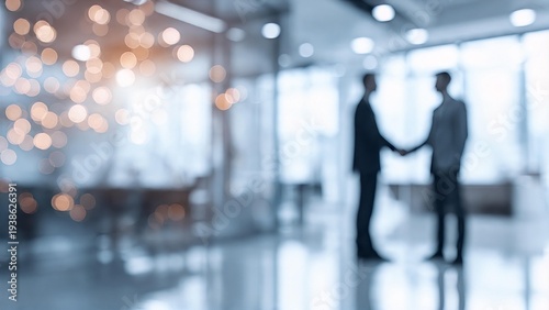 Blurred silhouette of two business professionals shaking hands in a modern office with bokeh lighting — partnership, deal, and corporate agreement concept