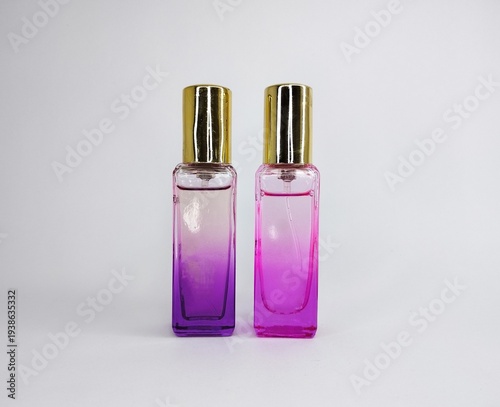 Two Different Shades Of Purple Glass Perfume Spray Bottles