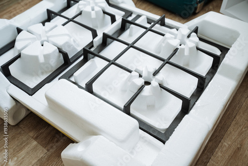 Detailed Product Photograph. Highresolution Image Of Cooktop Components. Closeup Shot Highlighting Stove Burner And Finish. Sharp Focus Image Showcasing Cast Iron And Enamel Burner Details