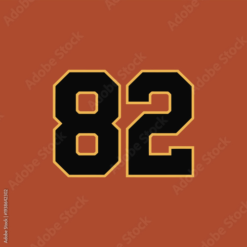 The number 82 is displayed in a bold font with a dark background and gold trim.