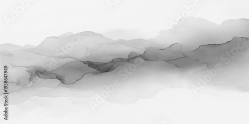 White smoke and clouds drift over a cold winter mountain landscape with a snowy peak, blue sky, and icy glacier water seen from an aerial morning view