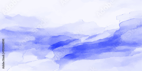 A breathtaking nature landscape features mist and fog drifting over snow covered mountains under a vibrant sunset sky at dawn