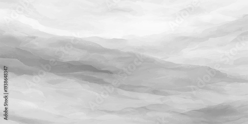 A breathtaking aerial view of high white clouds drifting through blue mountain peaks as fog blankets the nature landscape under a bright heaven light along the horizon