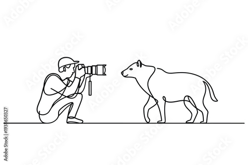 A photographer kneels to capture a portrait of a curious dog