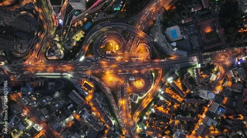 Aerial footage of Istanbul in time-lapse. Nighttime city lights, traffic scenes, vehicles in Istanbul traffic, bridges and Galata Tower.
