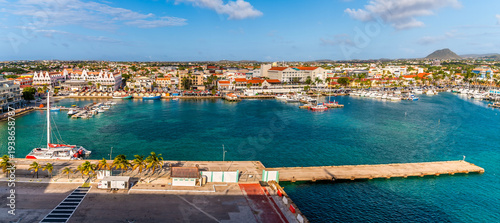 Fotografie A view from the cruise port across the marina in Oranjestad, Aruba on a bright m