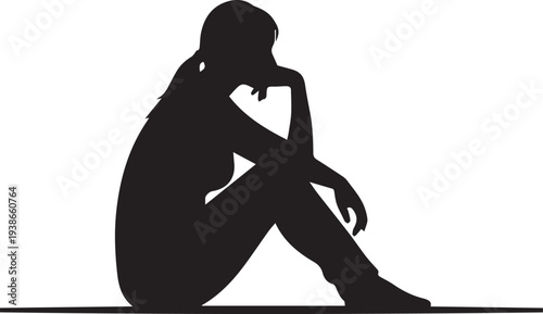 Silhouette of a Sad or Pensive Woman Sitting on the Floor in Contemplation
